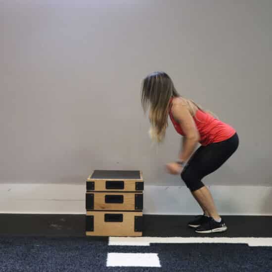 Trainers at Trilogy Fitness RI using equipment