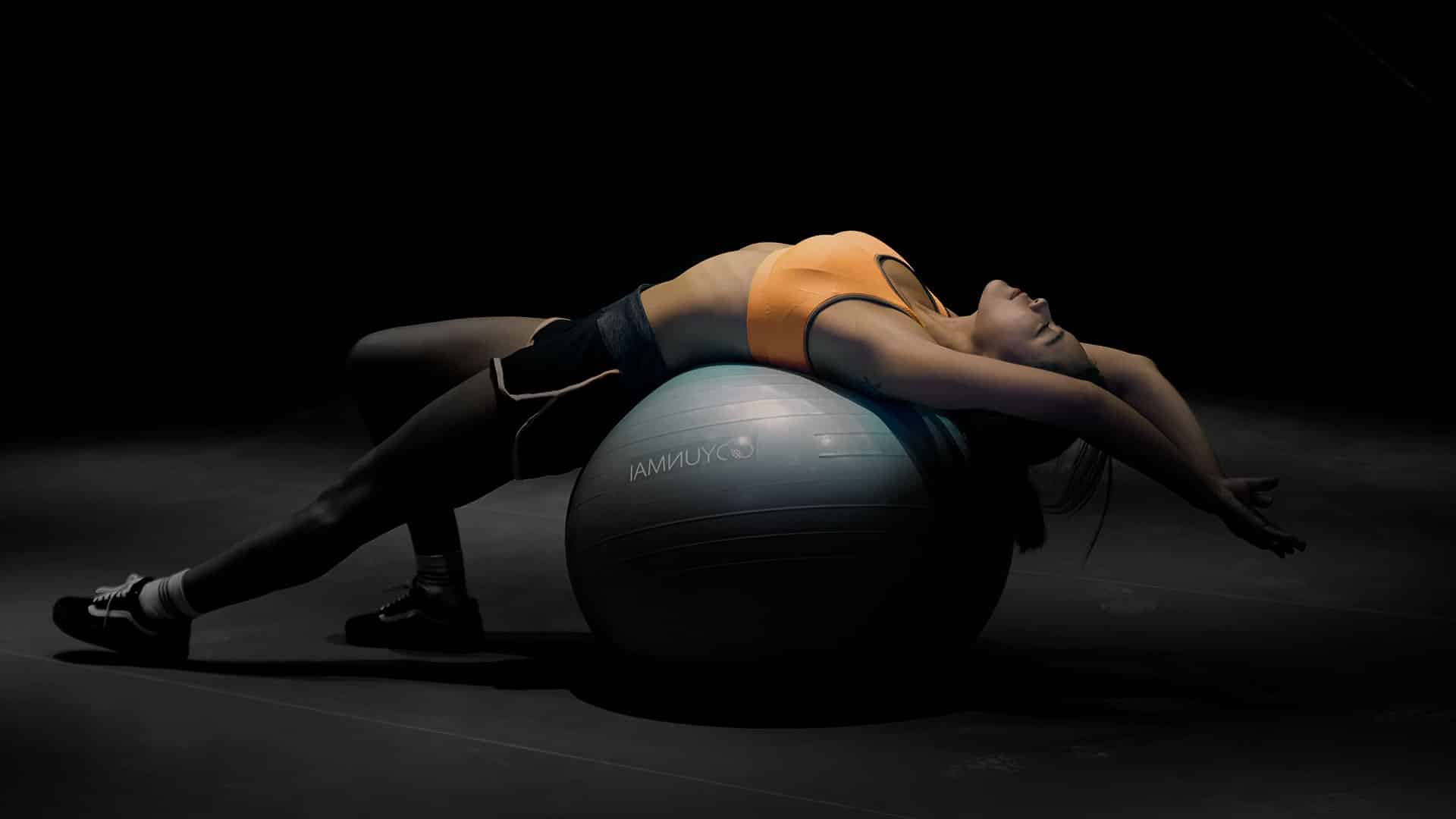 Woman using yoga ball